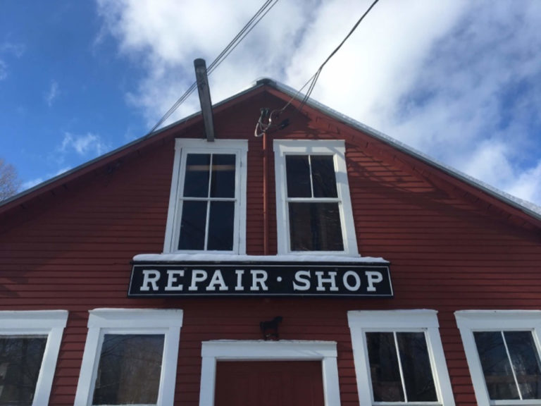 red repair shop with sign
