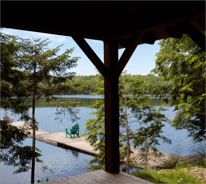 lake and dock with blue chair