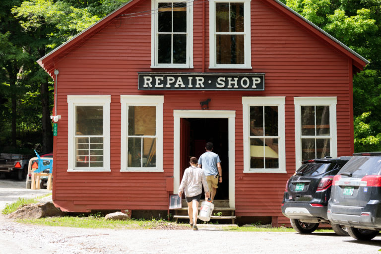 bright red repair shop with sign