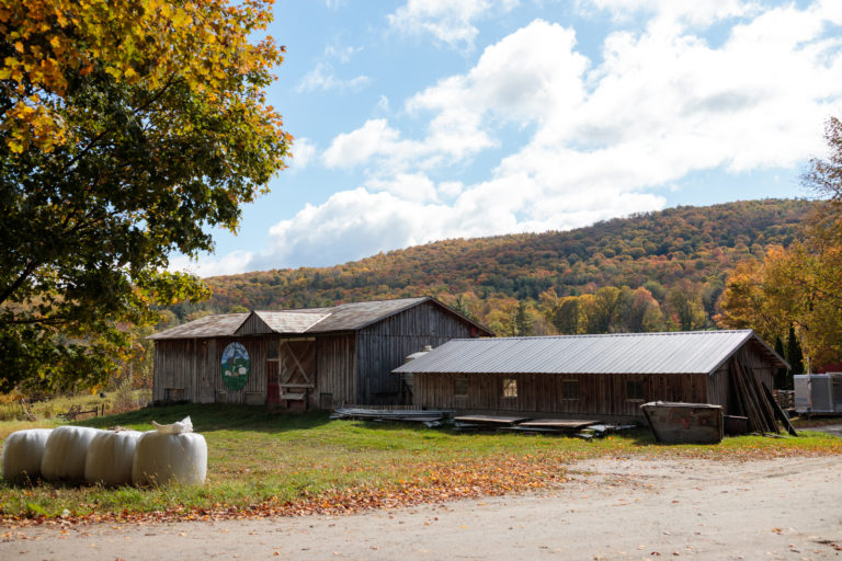barn buildings with autumn hills
