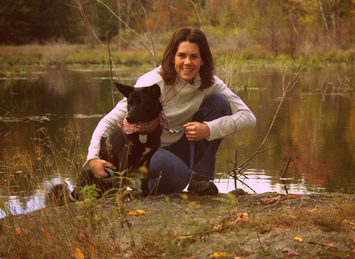 Becky Day by a lake with her dog